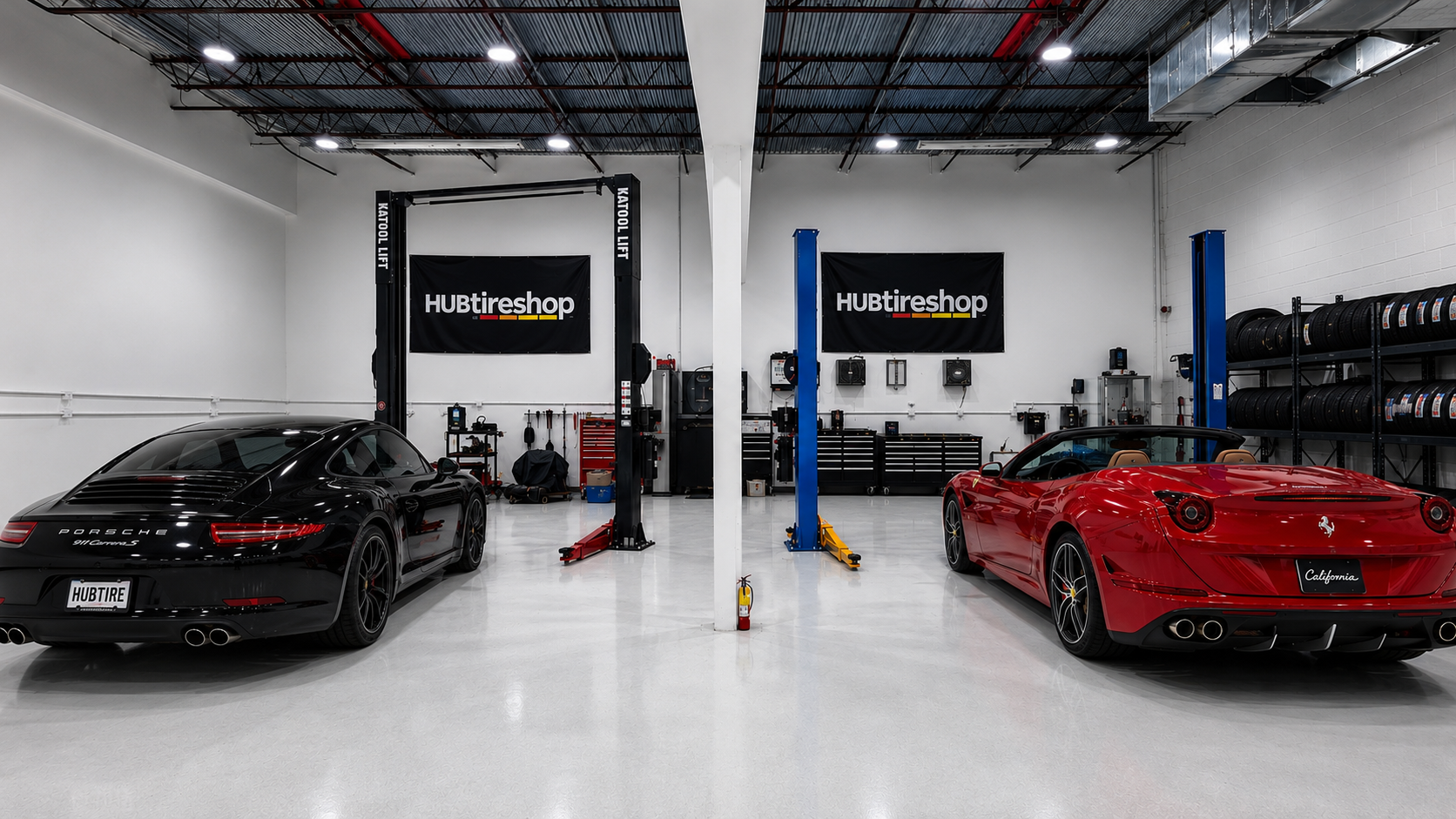 Inside the Hub Tire Shop service bay in Miami with vehicles on lifts